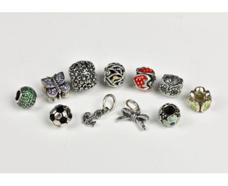 A small collection of Pandora silver charms all decorated with either enamel or CZs, including two dangle charms. (9)  