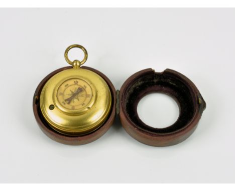 A red leather cased gilt metal travelling pocket barometer and compass combination early 20th century, of pocket watch form, 