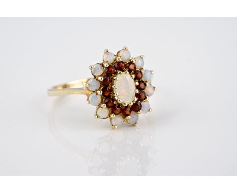 A 9ct gold, opal and garnet cluster ring size O.  