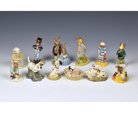 A collection of Royal Doulton figurines comprising Disney's 101 Dalmatians - Rolly; Lucky; Patch in basket; Penny and Freckle