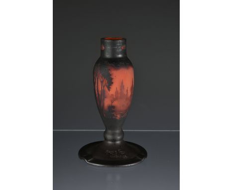 A Muller Fres cameo glass lamp base the ovoid stem on a wide circular foot with three flex frills, decorated with a wooded la