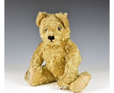 An Alpha Farnell golden mohair teddy bear c. 1930's, clear glass eyes, five stitched claws, pale pink felt pads, original lab