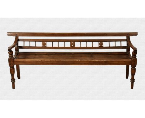 A Burmese colonial teak bench probably 19th / early 20th century, the low back rail over a triple pierced splat and ladder ba