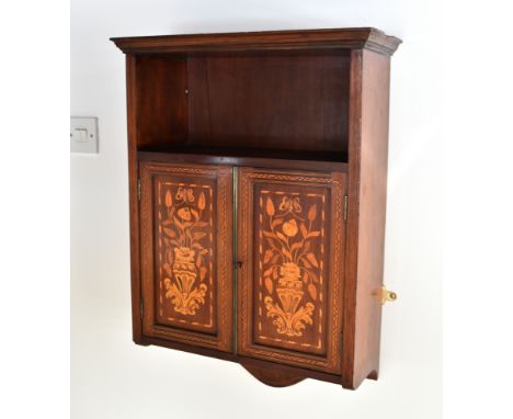 A 19th century walnut and marquetry hanging cabinet the flared cornice over an open shelf and pair of panelled cupboard doors