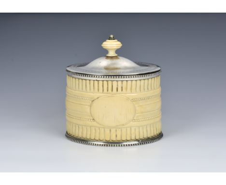 A Victorian ivory and silver plated tea caddy by Henry Atkin, of oval form, the ivory body carved with lappets, beading and a