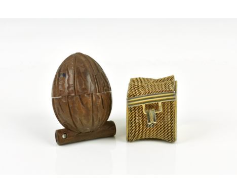 A novelty carved wood thimble case with Stanhope fashioned as a walnut the walnut sitting on a branch that holds the Stanhope