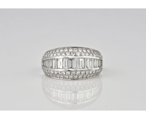 A Mappin &amp; Webb 'Beaumont' 18ct white gold and diamond ring the central line of graduated baguette cut diamonds bordered 