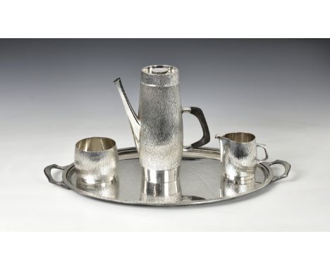 Asprey - a four piece Elizabeth II silver textured coffee service Asprey &amp; Co Ltd, London, comprising a coffee pot of sle