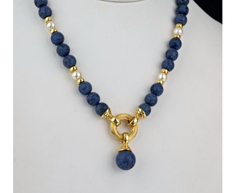 An 18ct yellow gold, Dumortierite and cultured pearl necklace with 7.5mm. Dumortierite beads, 6.5mm. cultured pearls and 18ct
