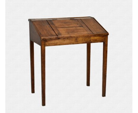 An antique pine clerks tally desk, circa 1800 the sloping top with raised moulded edge and central section, lifting to reveal