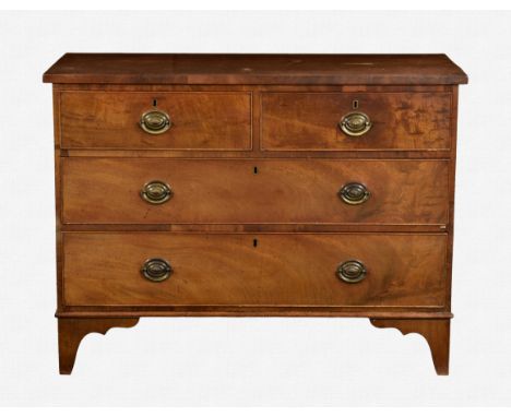 A 19th century mahogany chest of two short over two long drawers adapted from the top of a chest on chest, with oval brass ha