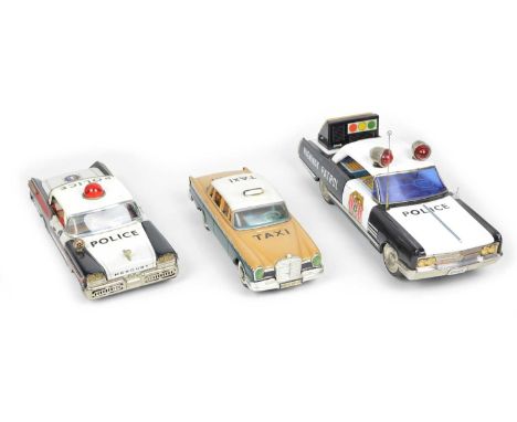 Three tinplate cars to include a large Ichiko Japanese Highway Patrol police car, battery operated tinplate example, with det