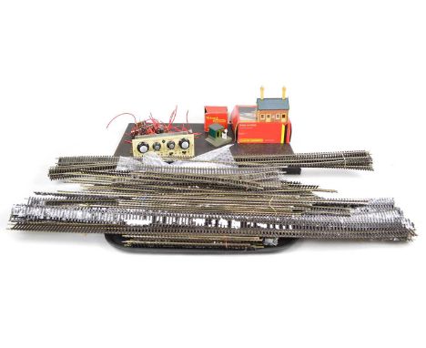 Peco streamline OO gauge track along with a model D.S. train controller, Hornby Branch Line Station and Tri-ang gate keeper b
