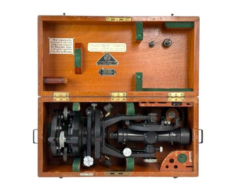 A Hilger & Watts micrometer theodolite. With a black lacquered finish, number 69900, in a mahogany transit case, length 43cm,