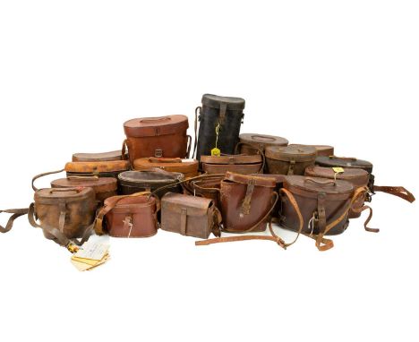 A quantity of leather binocular cases. Various makers including J.H Steward, F.Ltd, Crown Optical Co, Baltic Goods Co, all em