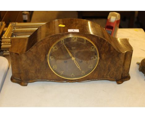 A German walnut cased two hole mantel clock