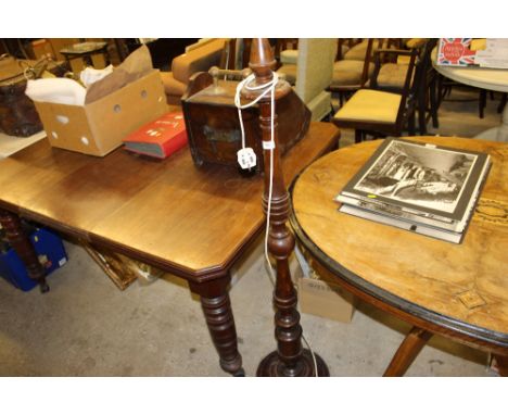 A turned mahogany standard lamp