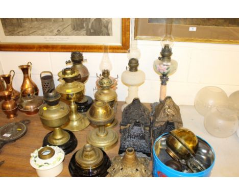 A quantity of oil lamp bases and parts