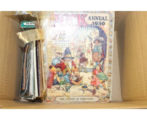 A box containing two sets of playing cards; a 1930's Puk Annual etc.