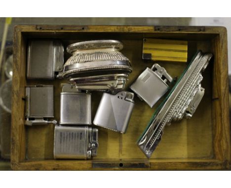 A quantity of various lighters contained in walnut box with enamelled playing card decoration