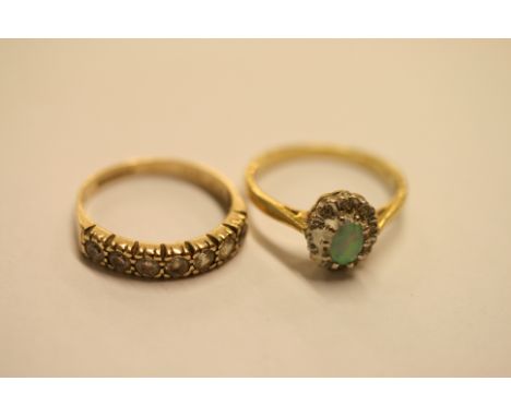 An 18ct gold opal ring and a 9ct gold and diamond ring