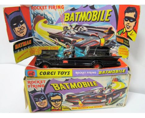 A Boxed Original Corgi #267 Rocket Firing Batmobile, 1966 version with gloss black body, red bat logo on doors, gold cast hub
