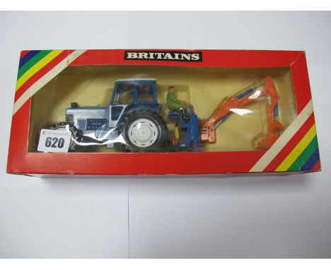 A Boxed Britains Farm #9598 1:32nd Scale Ford 7710 Tractor and Rear Digger, blue body, grey plastic hubs, orange digger, with