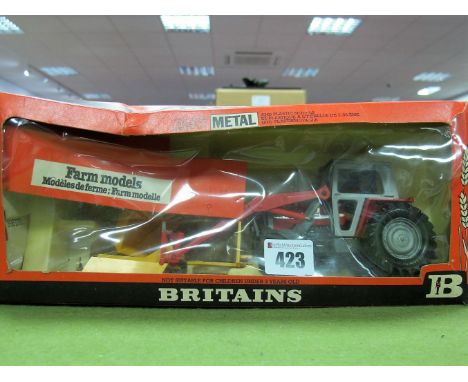 A Boxed Britains Farm #9595 1:32nd Scale Massey Ferguson 595 Tractor, with front low loader, red, silver and brown body, comp