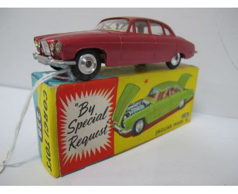 A Boxed Original Corgi #238 Jaguar Mark X, metallic cerise body, yellow interior, spun hubs, no luggage, two or three small c
