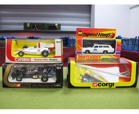 Three Original Window Boxed Corgi Die Cast Models, #154 black gold body, R.N. 1, black/red helmet, eight stud wheels, Emerson