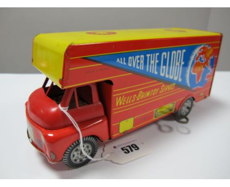 A Mid XX Century Wells Brimtoy Four Wheel Clockwork Lorry, side legend reads "All Over The Globe". Plastic cab, tinplate chas