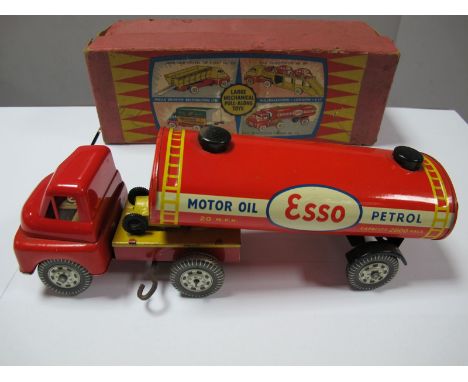 A Mid XX Century XX Century Wells Brimtoy Clockwork No. 712 Articulated 'Esso' Truck, tinplate except for plastic cab. Minor 