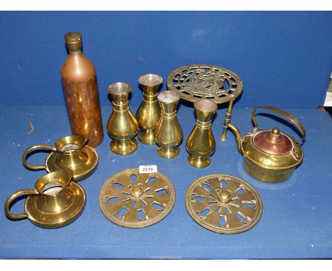 A quantity of brass including trivet, two pairs of vases, pair of jugs, two brass vents, copper flask, teapot, etc.