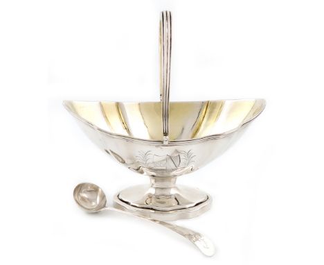 A George III silver swing-handled sugar basket and cream ladle, by Abraham Peterson, London 1790, the ladle by Smith and Hayt