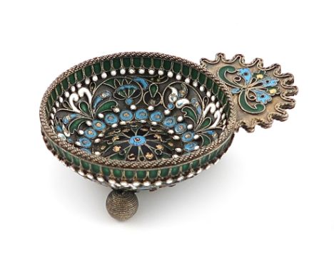 A silver and enamel Kovsch, unmarked, probably Russian, the circular bowl with vari-coloured enamel decoration, the handle wi