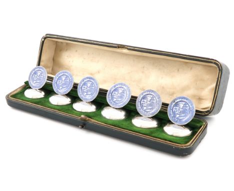 A set of six silver and enamel menu card holders, by Stuart Clifford & Co, London 1910, circular form, enamelled with blue an