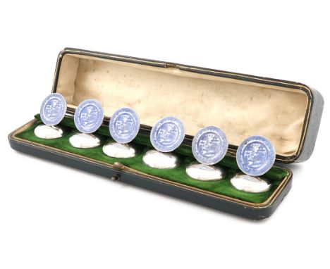 A set of six silver and enamel menu card holders, by Stuart Clifford & Co, London 1910, circular form, enamelled with blue an