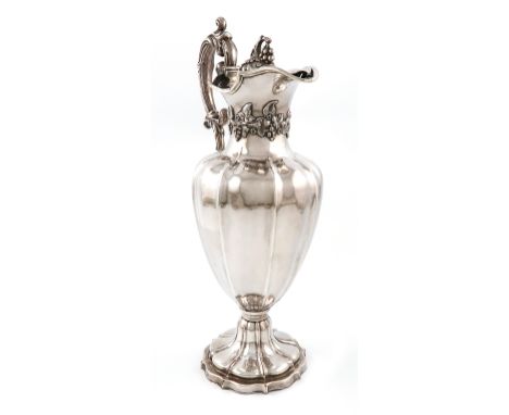 An early 19th century old Sheffield plated ewer, unmarked, circa 1830, lobed baluster form, leaf capped scroll handle, applie