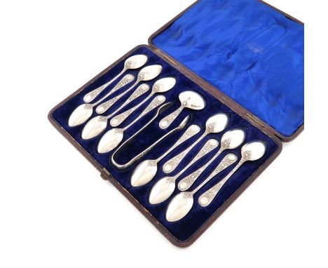 A set of twelve Victorian silver Venetian pattern teaspoons with a caddy spoon and pair of sugar tongs, by Martin, Hall and C