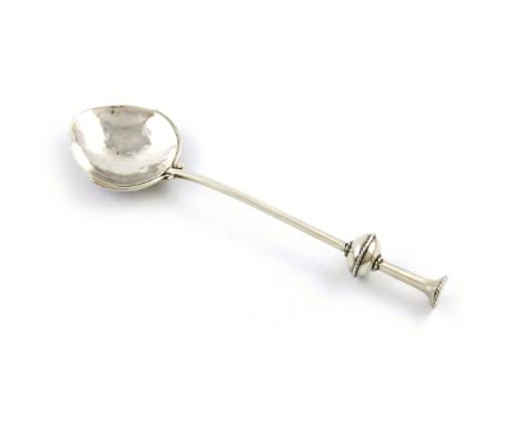 By A. E. Jones, an Arts and Crafts silver spoon, Birmingham 1918, spot-hammered heart shaped bowl with scroll rib supports, f