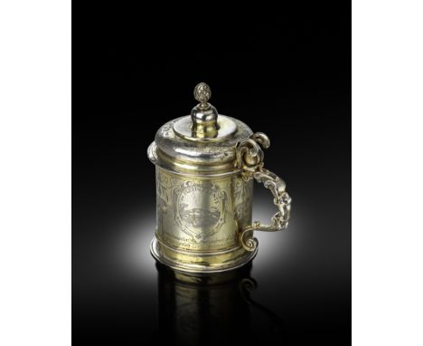 An early 17th century German silver-gilt tankard, by Peter Wiber, Nürnberg, circa 1620, circular form, the body with engraved