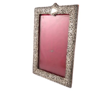 A late-Victorian silver photograph frame, by H. Matthews, Birmingham 1894, upright rectangular form, pierced and embossed fol