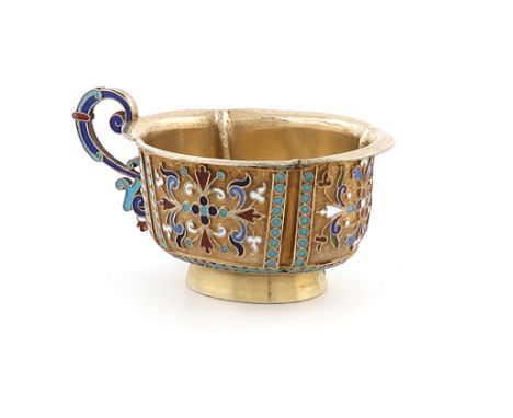 A late-19th century silver-gilt and enamel vodka cup, by Ivan Saltykov, Moscow 1888, lobed oval form, with vari-coloured foli
