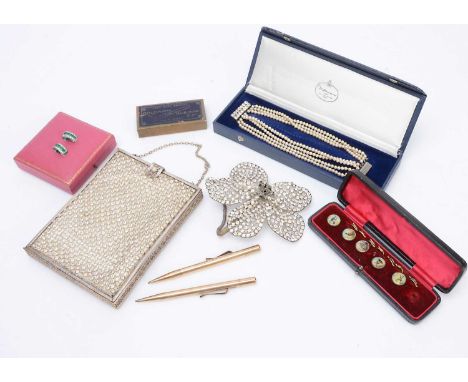 An art deco silver plated and paste set evening bag,  of rectangular form with bottom hinge to reveal a fitted silk interior,