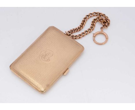 An Edwardian 9ct gold lady's compact and aide memoire, the front engine turned with open circular engraved cartouche, with sp