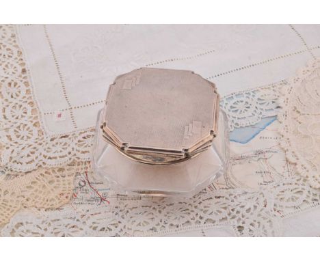 An art deco style silver topped glass dressing table pot, of square squat form with circular top and lid with puff, Sheffield