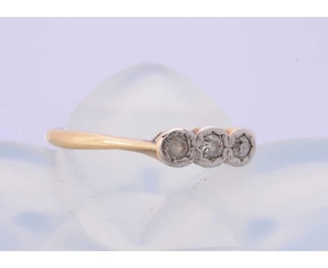An 18ct gold and platinum set three stone illusion dress ring, ring size K, 1.6g