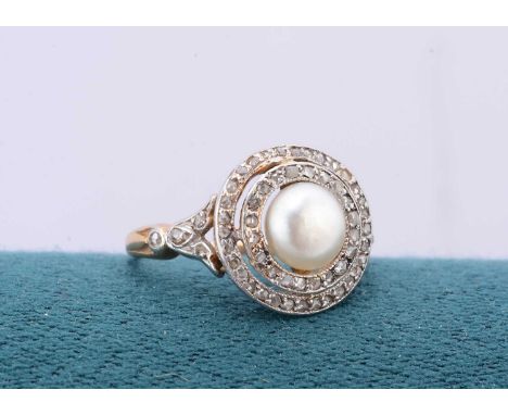 A Belle Epoque diamond and pearl 18ct gold and platinum set target dress ring, the central pearl surrounded by two stepped ba