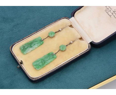 A pair of art deco Chinese jadeite jade drop earrings, the roundel panels supporting fine rectangular carved panels of gourds