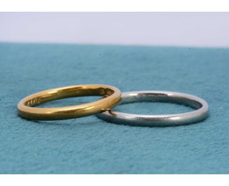 A platinum wedding band, of rounded form, ring size P 1/2, 2mm wide together with a 22ct gold wedding band dated 1922, ring s